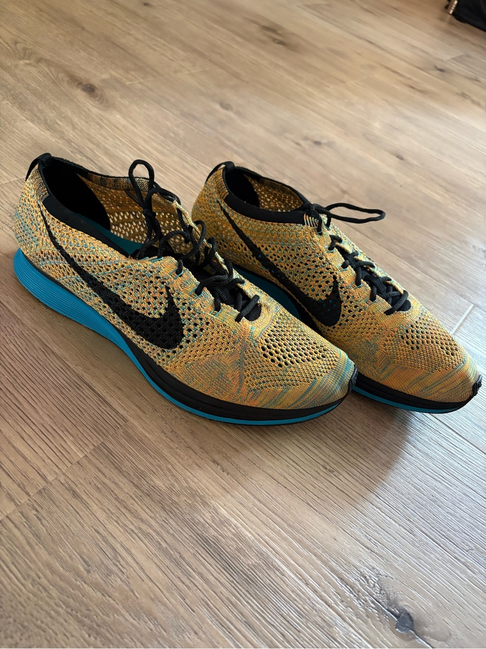 Nike Yellow Flyknit Running Shoes with Teal Midsole